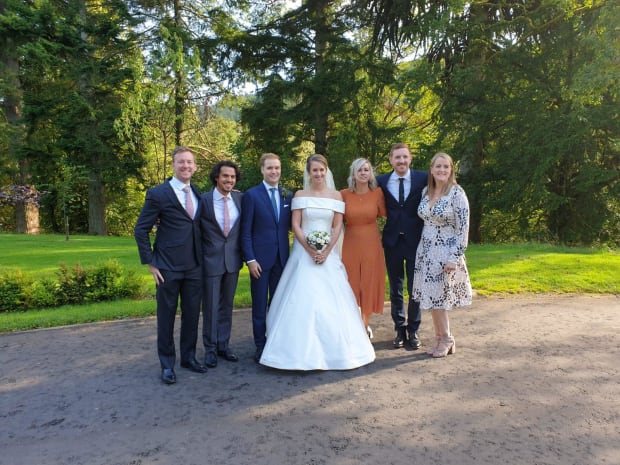 A university friends group photo at Charlotte and Rob's wedding