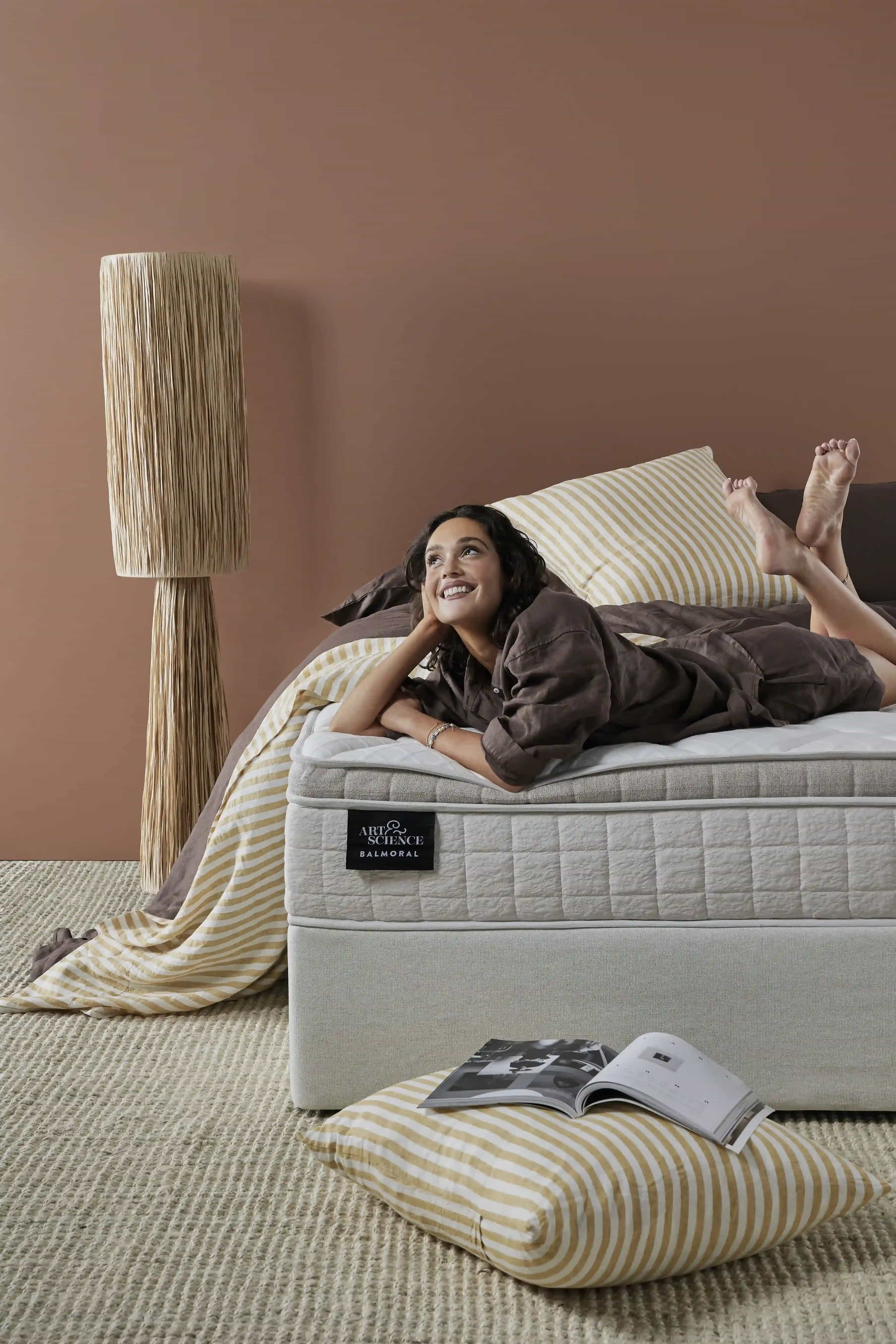 Woman lounging in a Sleeping Giant bed