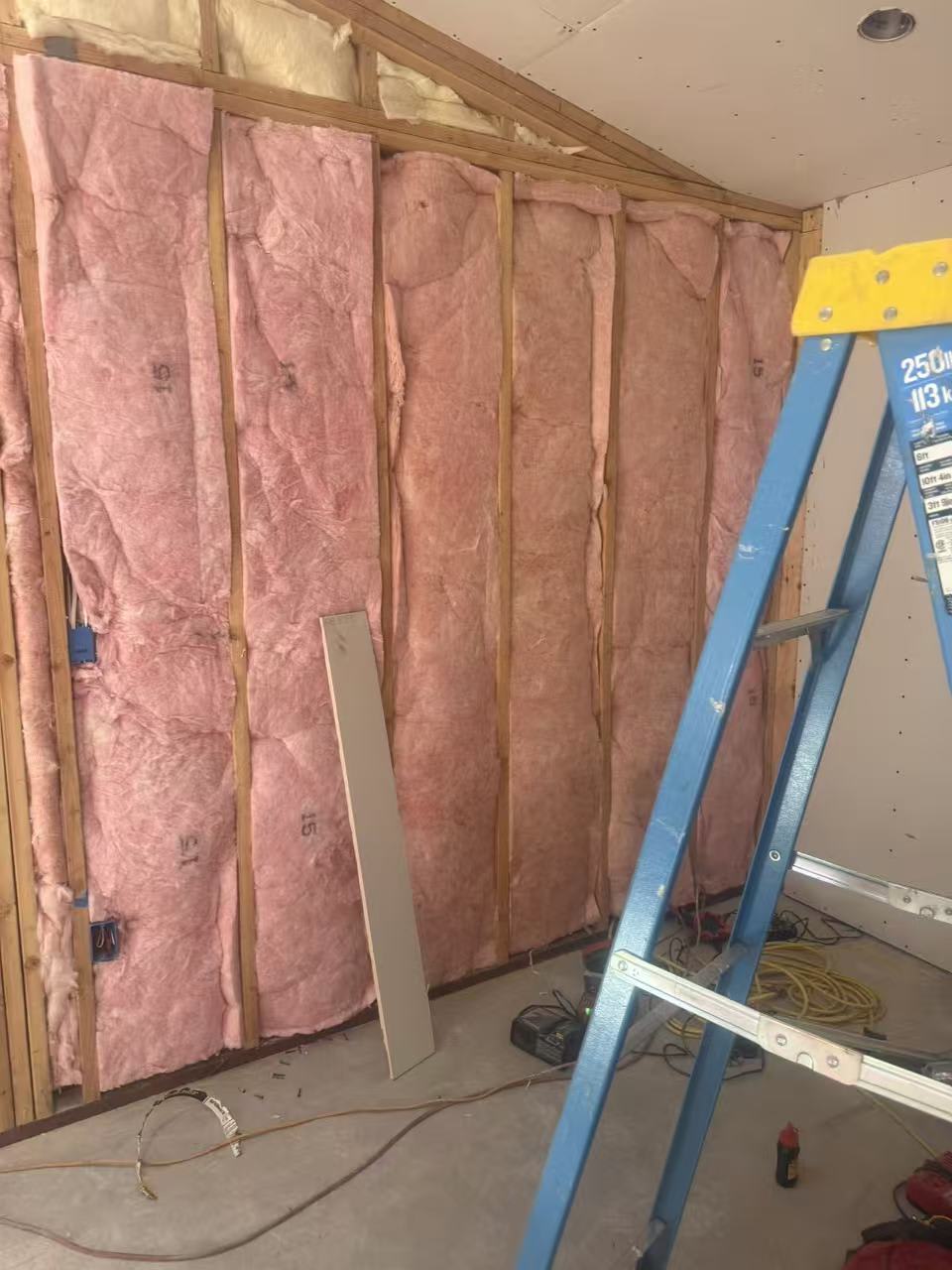 Fiberglass batt insulation installed