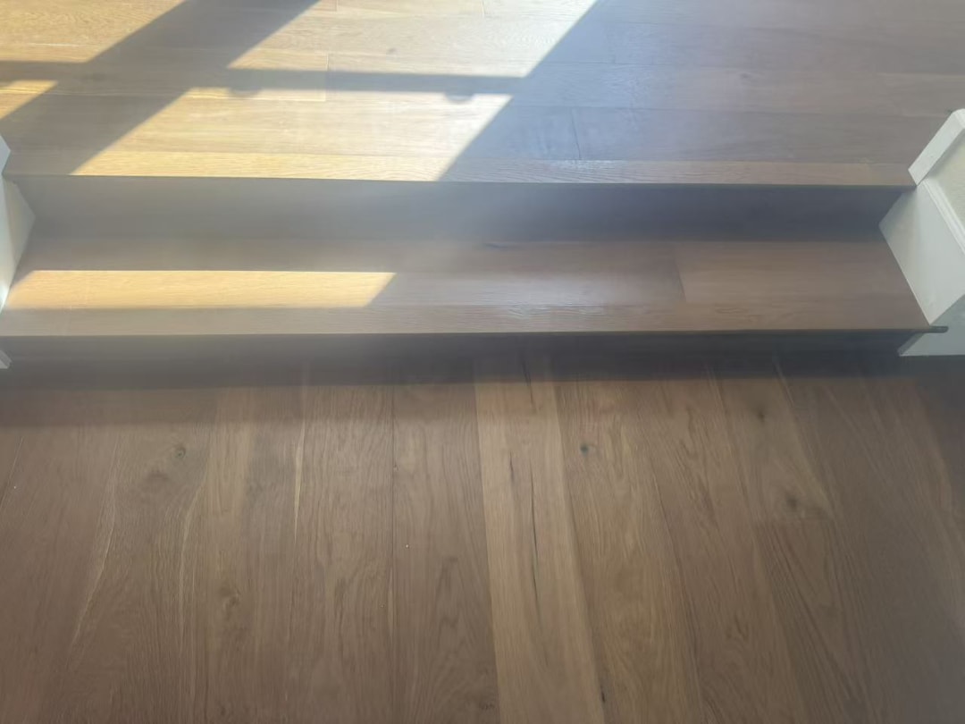 Hardwood flooring meeting stair threshold