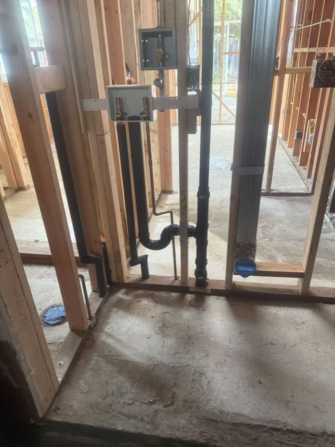 Rough-in plumbing and wiring before drywall