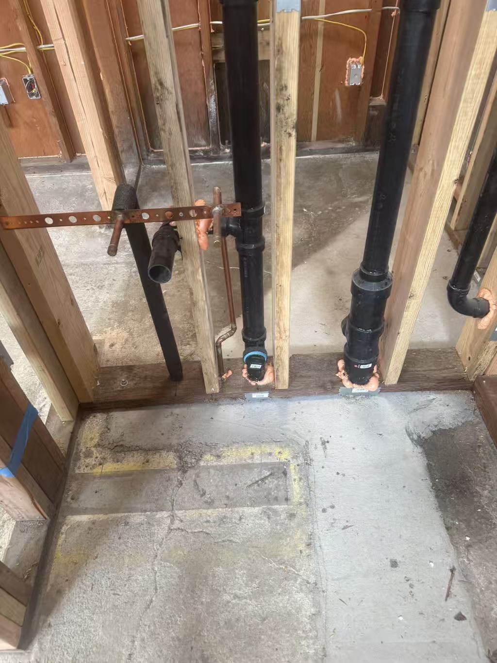 Copper piping installed in stud bay