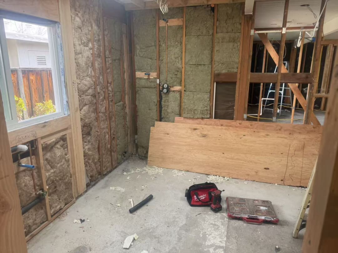 Framed bathroom awaiting plumbing hookups