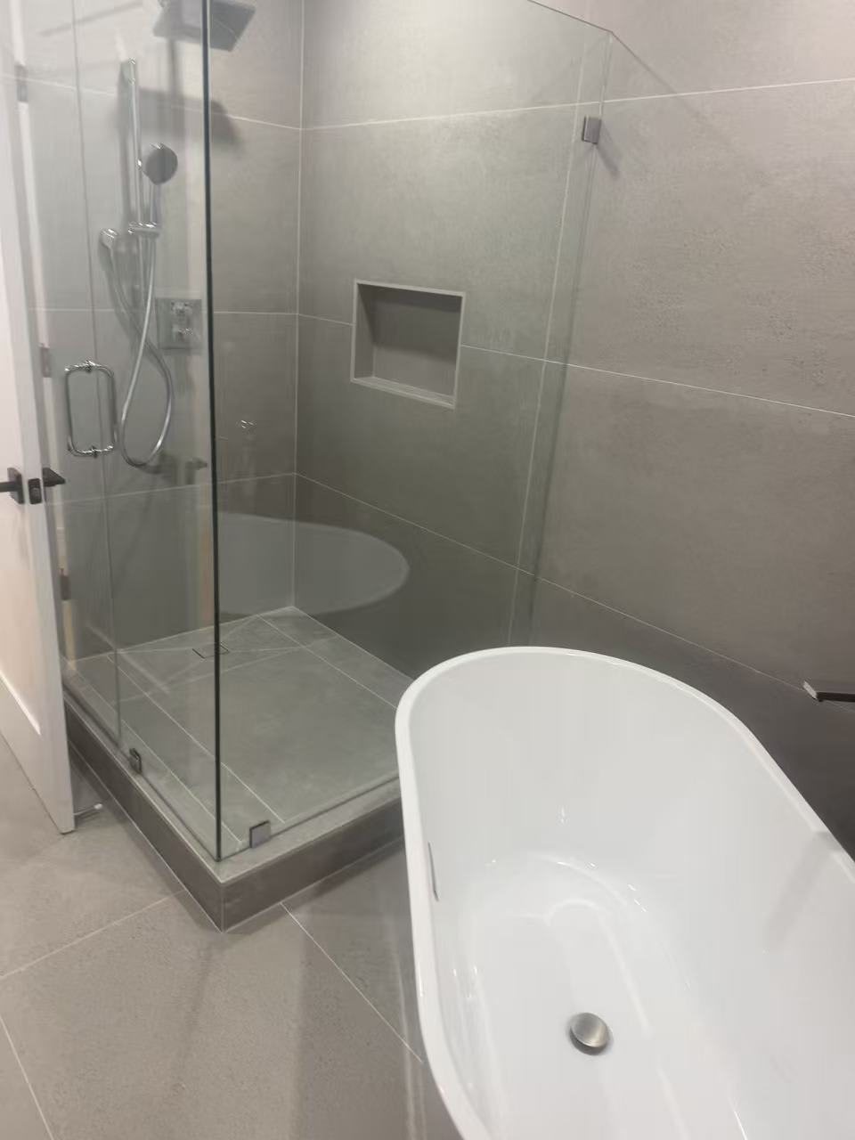 Freestanding tub and glass shower enclosure