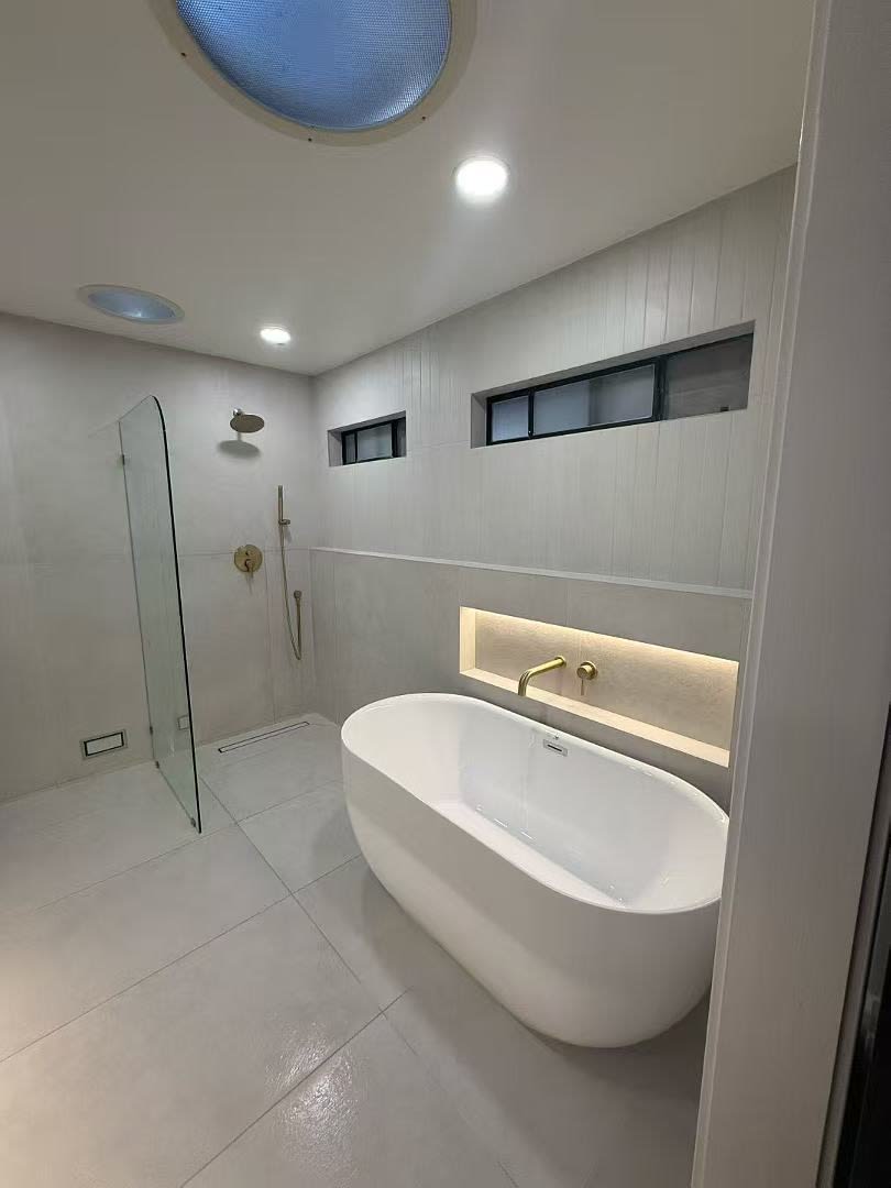 Glass shower with black-framed door