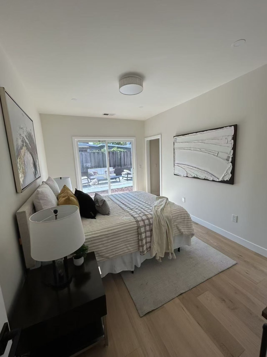 Primary bedroom with vaulted ceiling