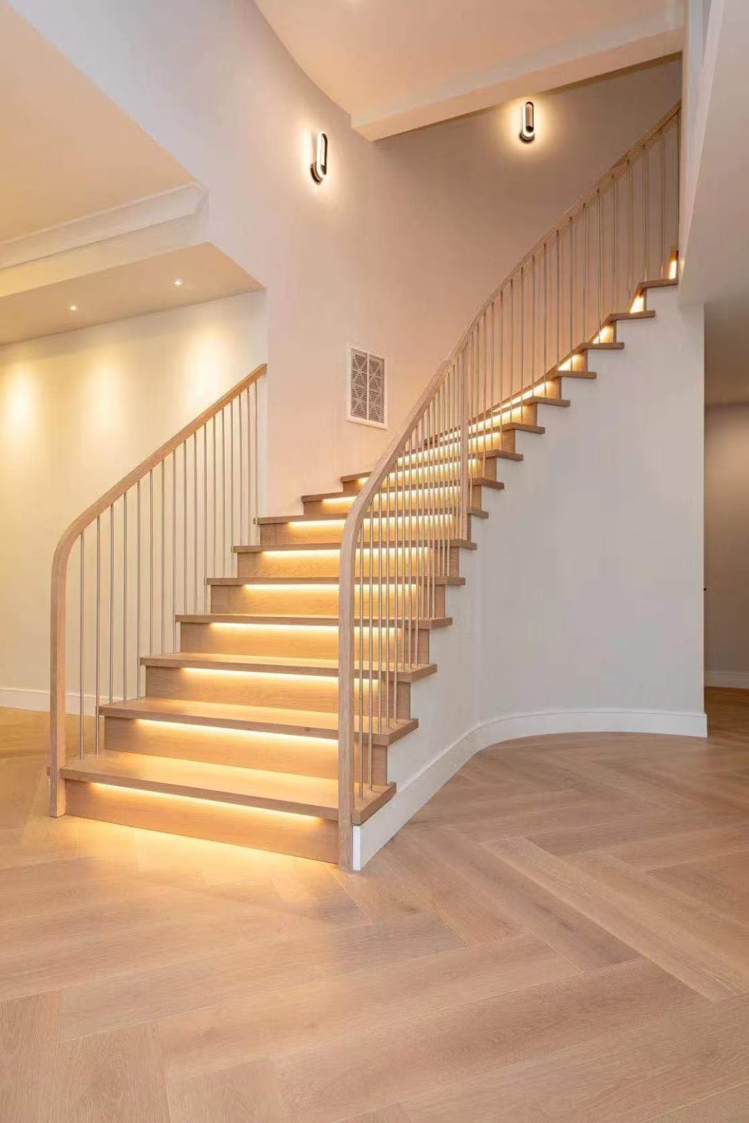 Open-riser staircase with metal balusters