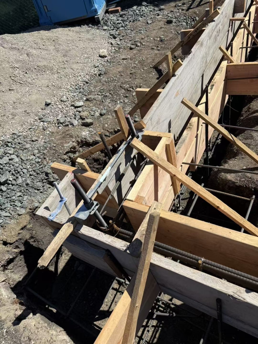 Wood bracing supporting foundation forms
