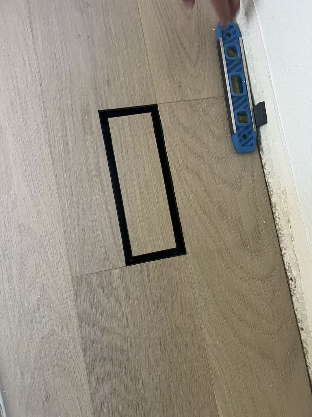 Marked drywall ready for outlet cutout