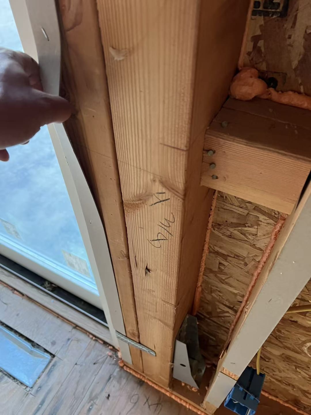 Rafters meeting ridge at window