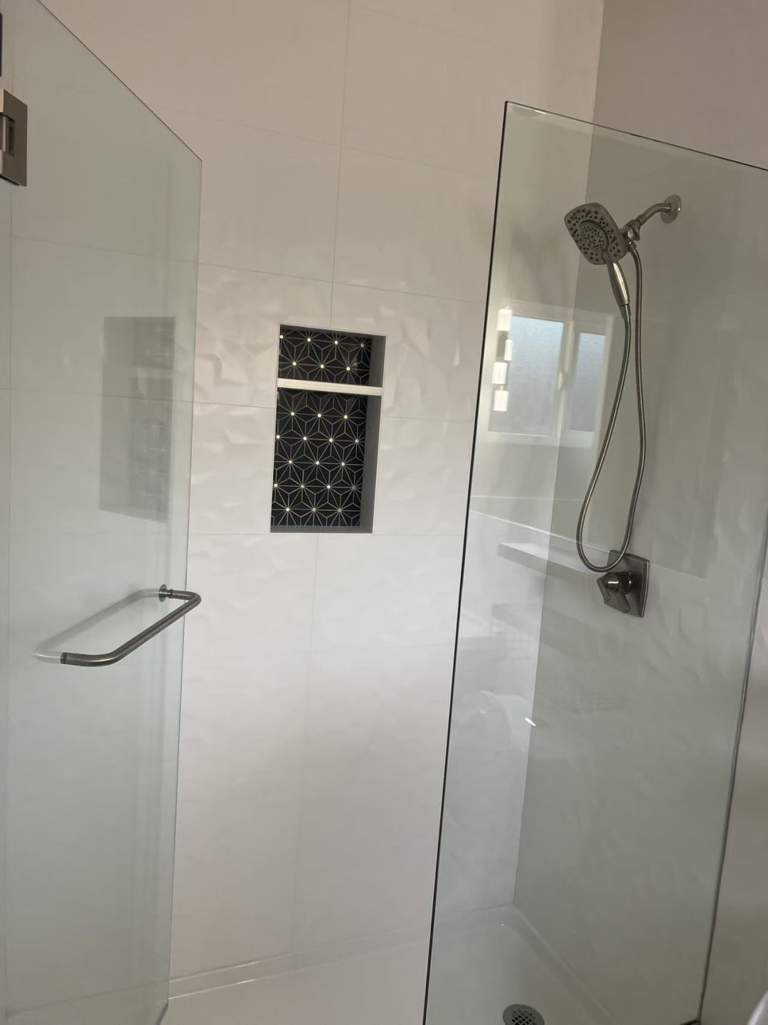 Glass shower enclosure with black frame