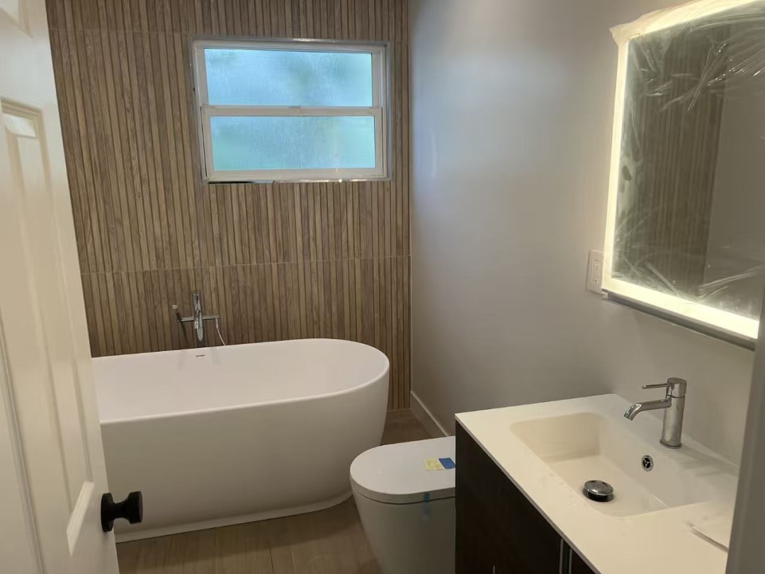 Bright bathroom with backlit mirror