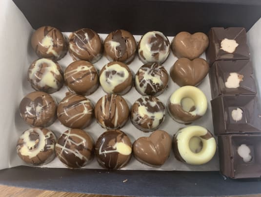 Two day chocolate making class - filled chocolates, truffles and a chocolate decorated chocolate cake.