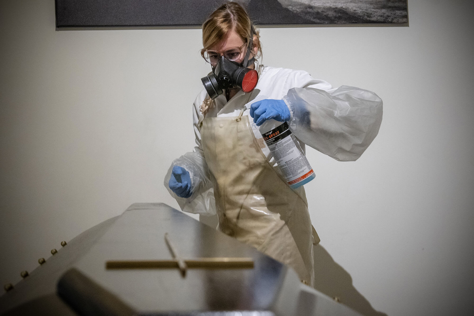 <p>BELGIUM: Funeral home staff disinfect the casket of a person who died of COVID-19 in Brussels. Philip Reynaers/Photo News/Getty Images</p>