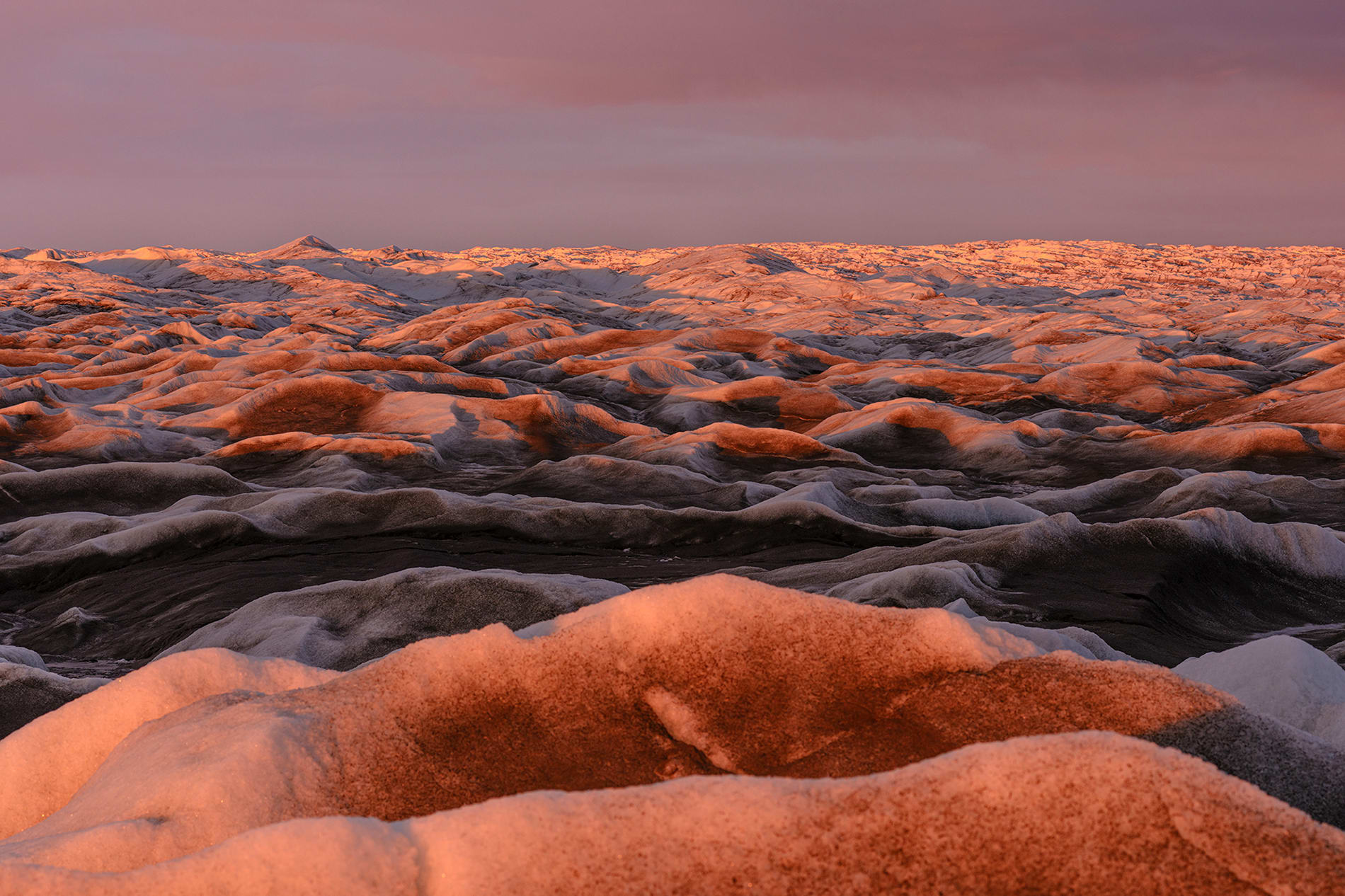 View of the ice sheet in Greenland under the midnight sun.