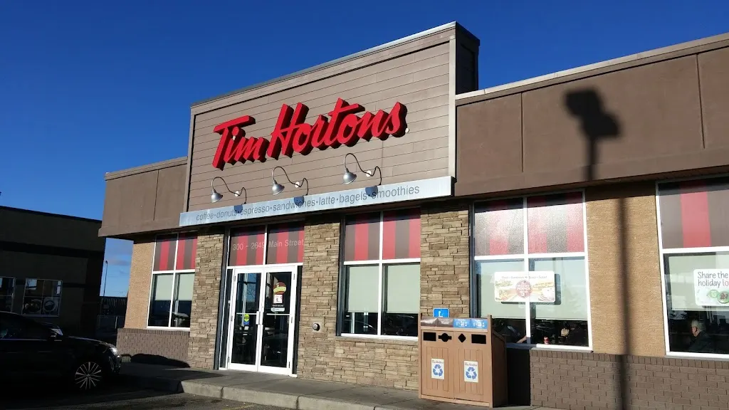 Tim Hortons storefront and interior at 300-2649 Main St Sw, Airdrie, AB
