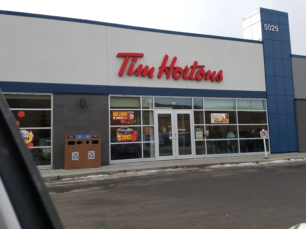 Tim Hortons storefront and interior at 115-5029 Nosehill Dr Nw, Calgary, AB