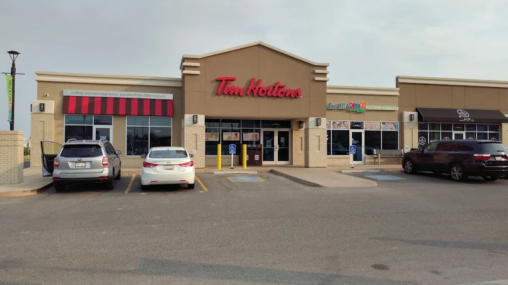 Tim Hortons storefront and interior at 12580 Symons Valley Rd Nw, Calgary, AB
