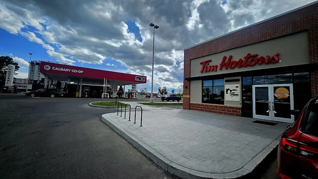 Tim Hortons storefront and interior at 130 -   8810  Macleod Trl Se, Calgary, AB
