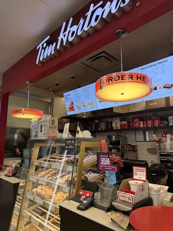 Tim Hortons storefront and interior at 15150 Mount Mckenzie Dr Se, Calgary, AB
