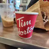 Tim Hortons storefront and interior at 1729 Mountain Ave, Canmore, AB