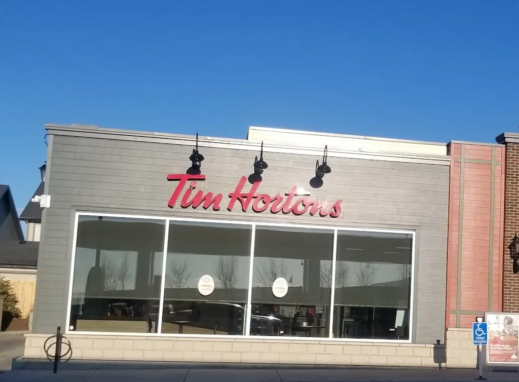 Tim Hortons storefront and interior at 1105-23 Heartland Blvd, Cochrane, AB