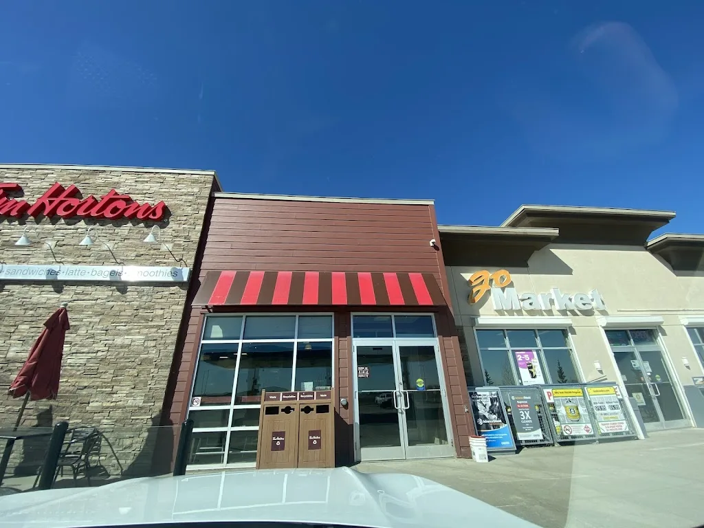 Tim Hortons storefront and interior at 2409 16 St, Didsbury, AB