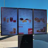Tim Hortons storefront and interior at 606 West Industrial Road, Hanna, AB