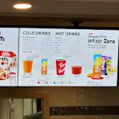 Tim Hortons storefront and interior at 611 Patricia St, Jasper, AB