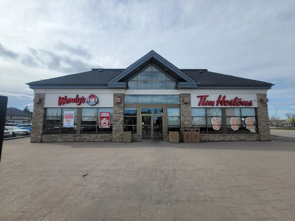 Tim Hortons storefront and interior at 18 Southridge Dr, Okotoks, AB