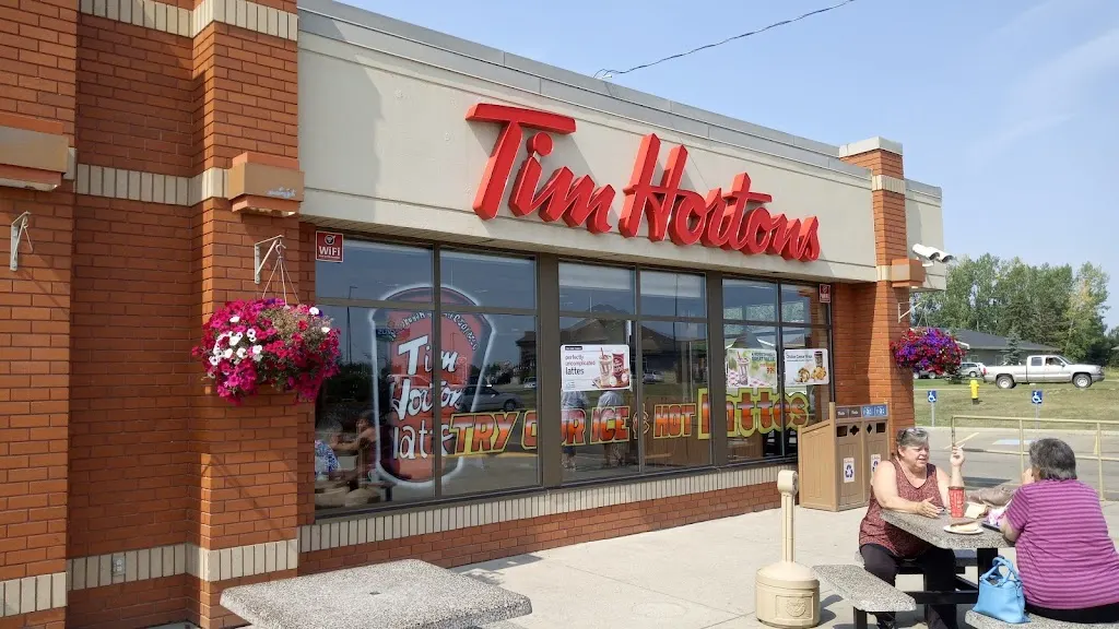 Tim Hortons storefront and interior at 4750 Hwy 2a, Ponoka, AB