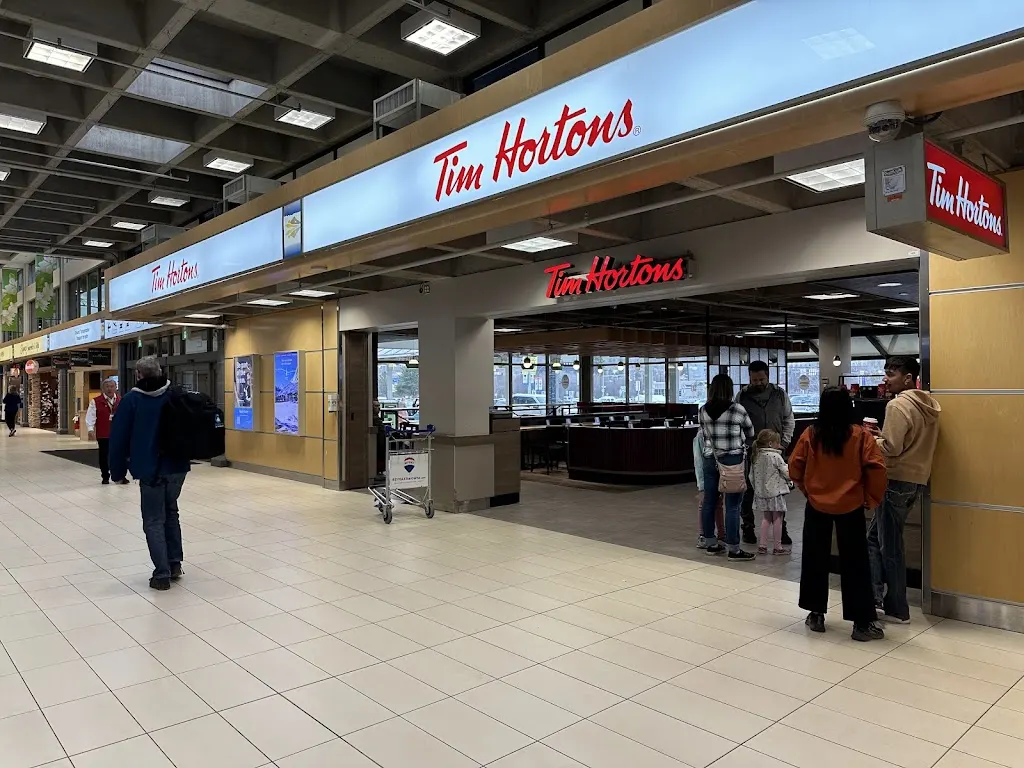 Tim Hortons storefront and interior at 5533 Airport Way, Kelowna, BC