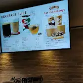 Tim Hortons storefront and interior at 132 Esplanade West, North Vancouver, BC