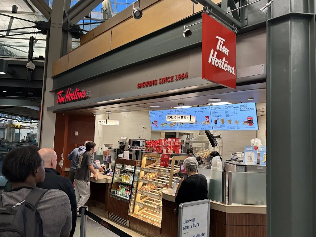 Tim Hortons storefront and interior at 3880 Grant Mcconachie Way, Richmond, BC