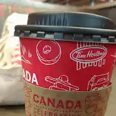 Tim Hortons storefront and interior at 607 Dunsmuir St, Vancouver, BC