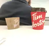 Tim Hortons storefront and interior at 750 West Pender St, Vancouver, BC