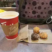 Tim Hortons storefront and interior at 750 West Pender St, Vancouver, BC