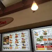 Tim Hortons storefront and interior at 865 West Broadway, Vancouver, BC