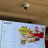 Tim Hortons storefront and interior at 1299 Robson St, Vancouver, BC