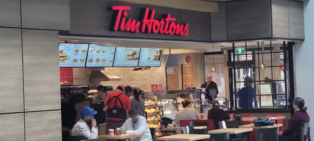 Tim Hortons storefront and interior at 1635 Commercial Dr, Vancouver, BC