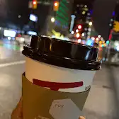 Tim Hortons storefront and interior at Ground Level - 1055 Georgia St W, Vancouver, BC