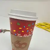 Tim Hortons storefront and interior at 11 Davis Way, Rosser, MB