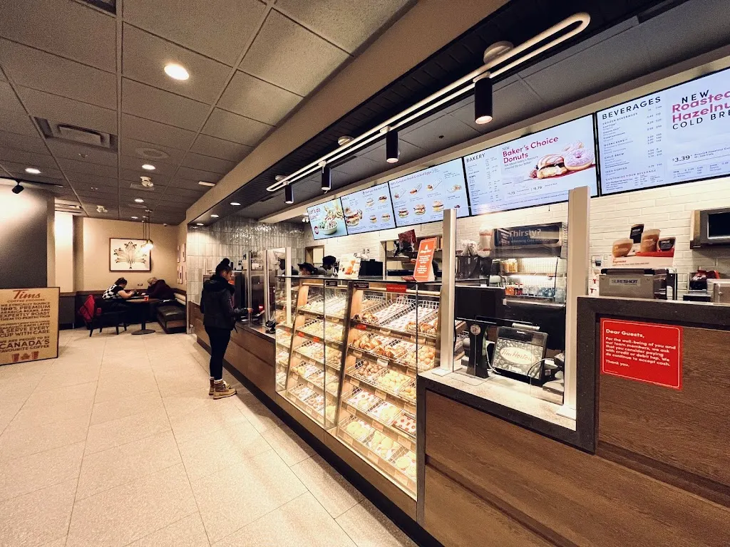 Tim Hortons storefront and interior at 1 Lombard Ave, Winnipeg, MB