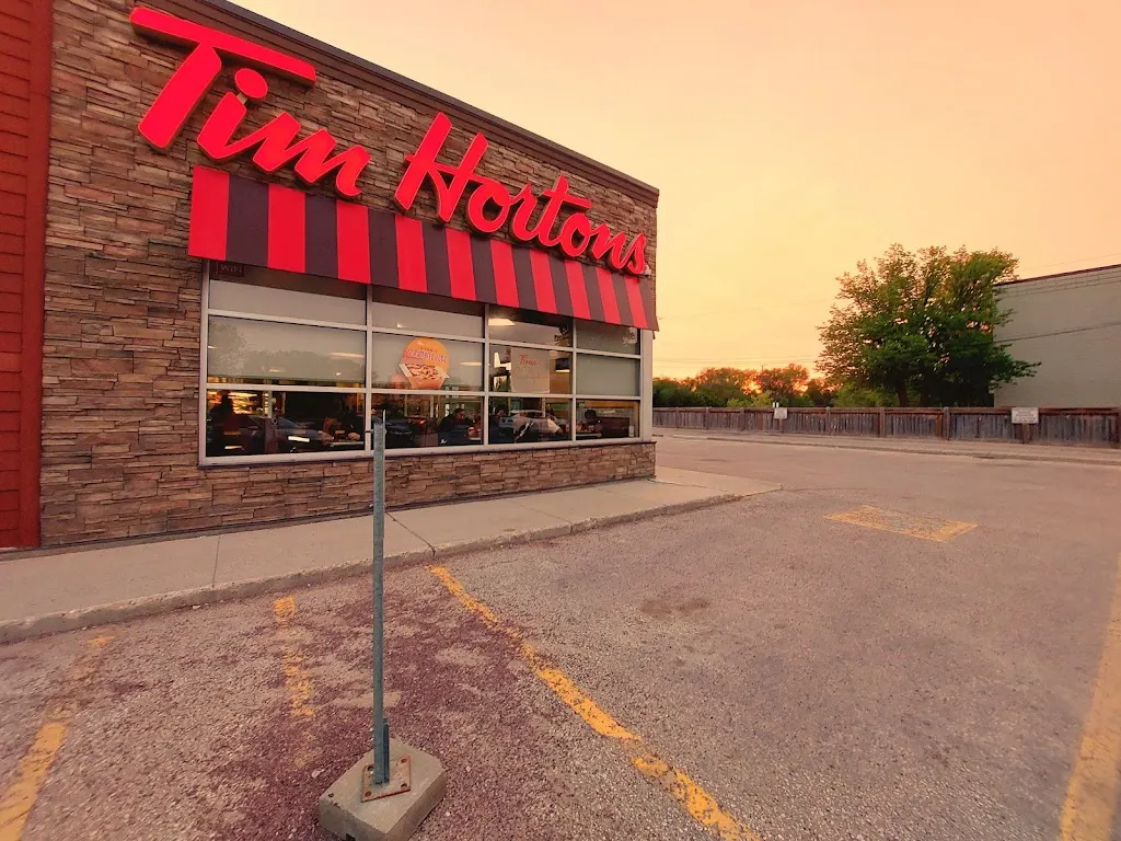 Tim Hortons storefront and interior at 240 Graham Ave, Winnipeg, MB