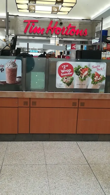 Tim Hortons storefront and interior at 1555 Regent Ave West, Winnipeg, MB