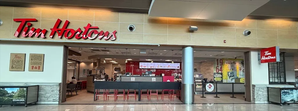 Tim Hortons storefront and interior at Arrivals Level: St. John's International Airport, St. John's, NL