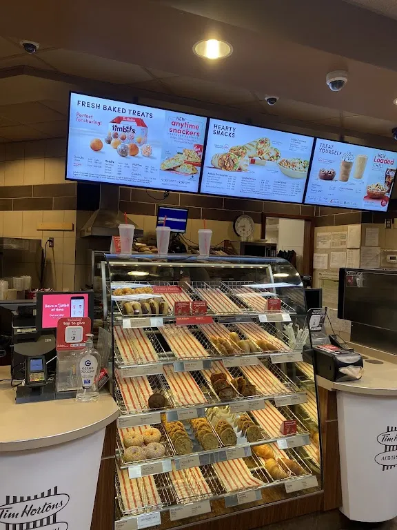 Tim Hortons storefront and interior at 9966 Grenville St, Saint Peters, NS