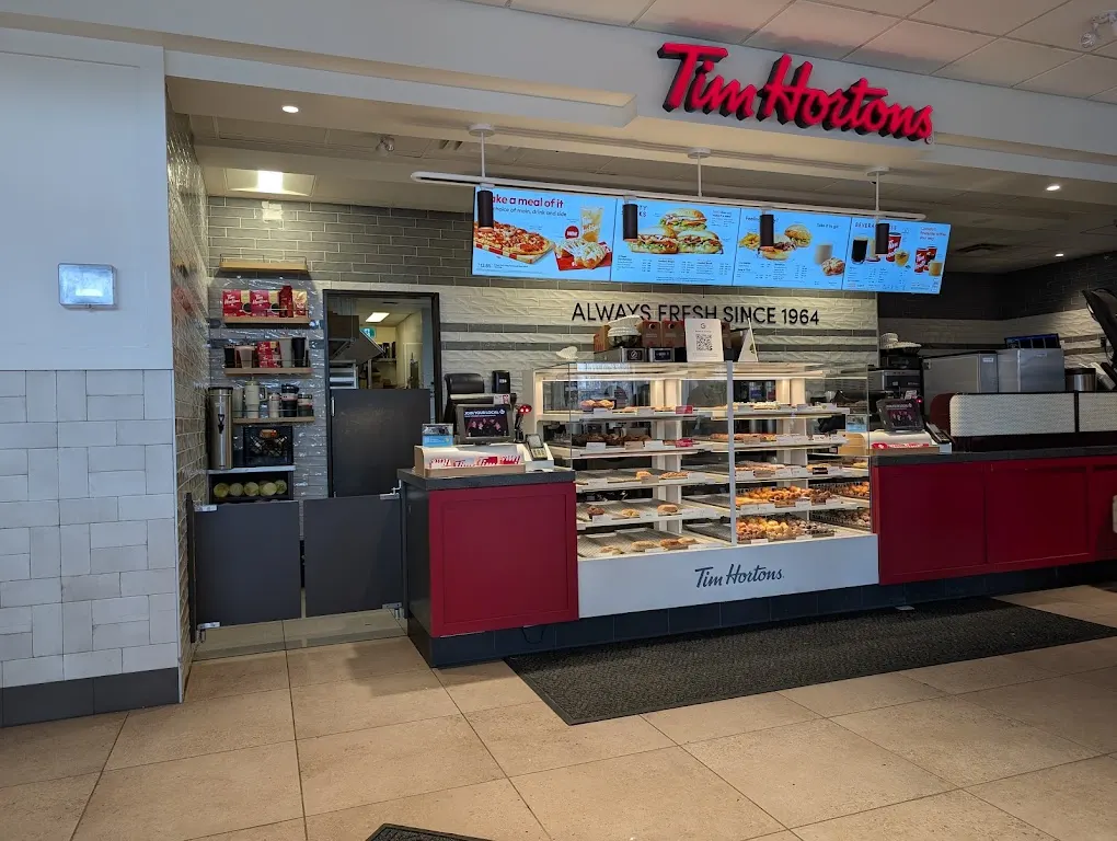 Tim Hortons storefront and interior at 304 Wellington St East, Aurora, ON