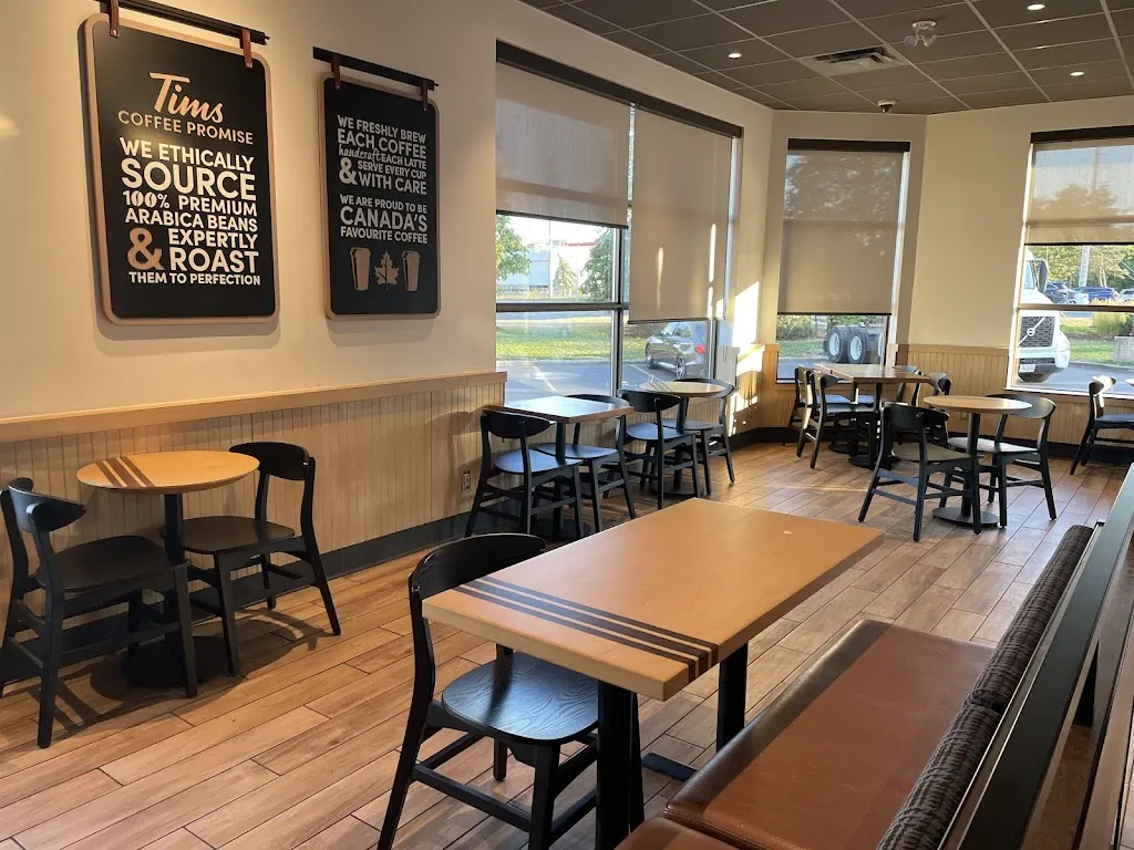 Tim Hortons storefront and interior at 2 Intermodal Dr, Brampton, ON