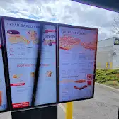 Tim Hortons storefront and interior at 3485 Harvester Rd, Burlington, ON